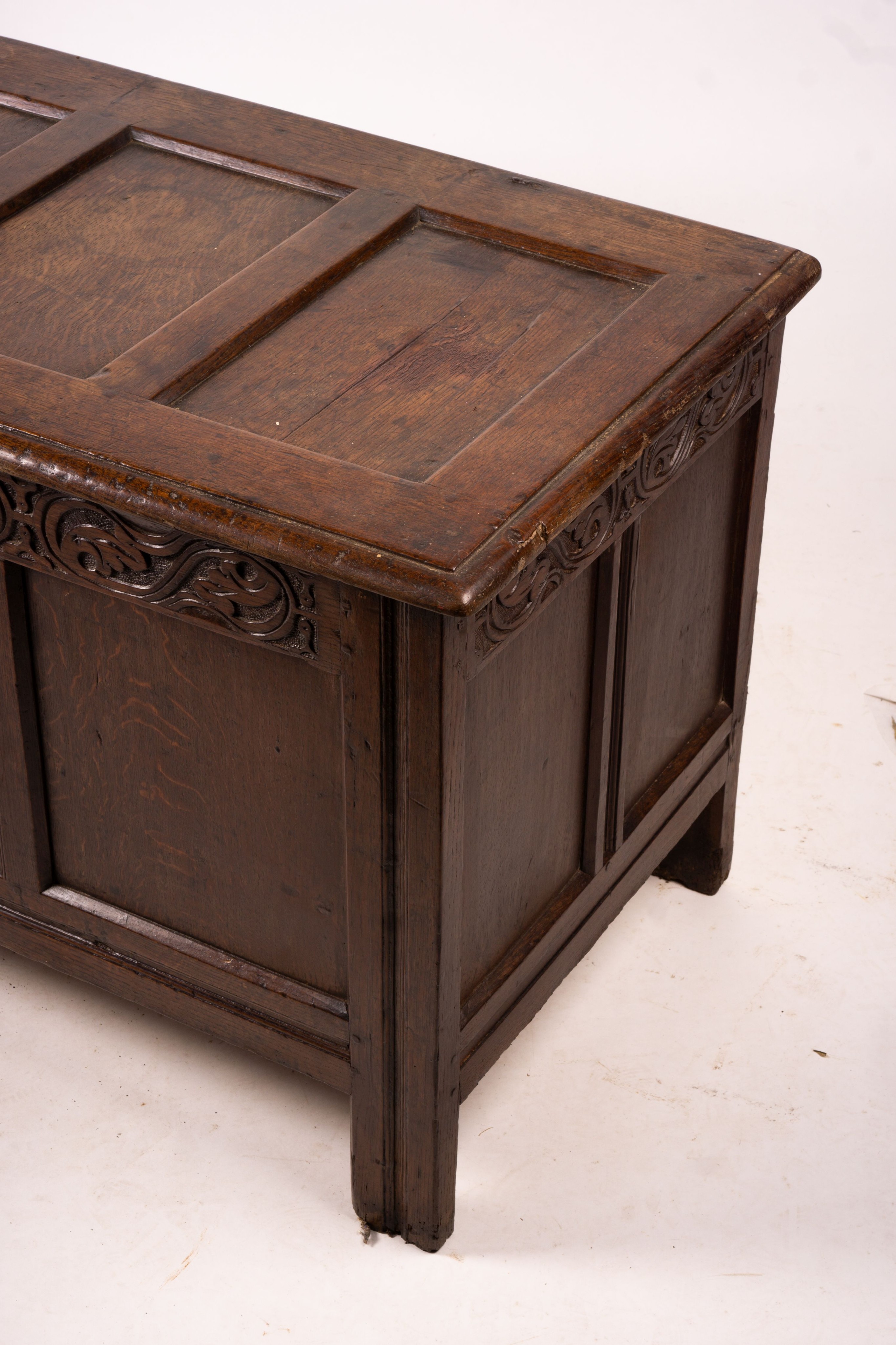 A 17th century panelled oak coffer, W.122cm D.55cm H.65cm